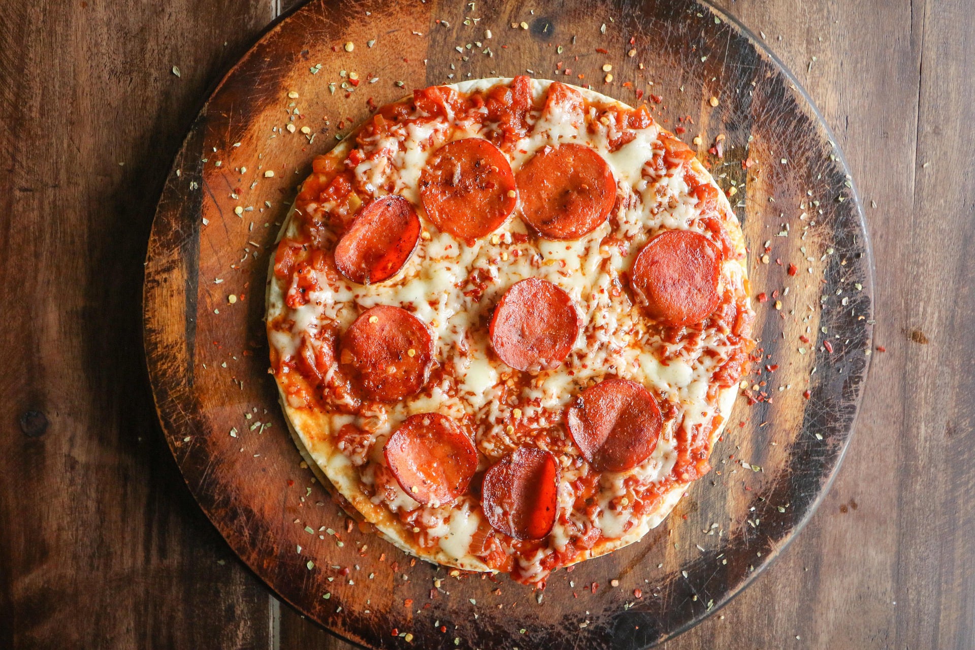Oven-baked pizza with pepperoni, photographed from above