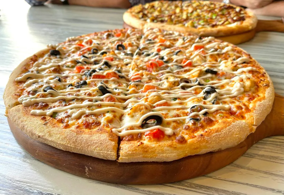 Thin-crust Italian pizza set out for a cooking class